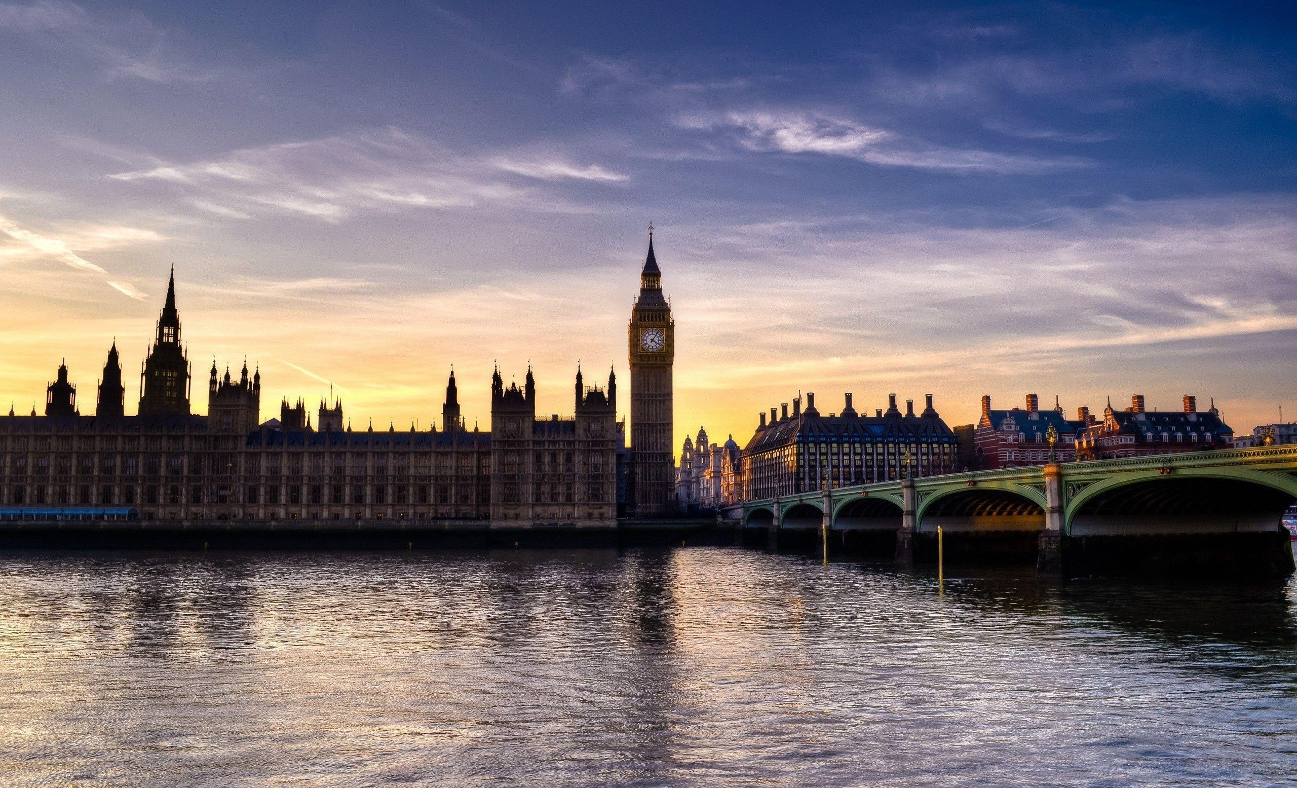The Houses of Parliament and Westminster Bridge in London at sunset
